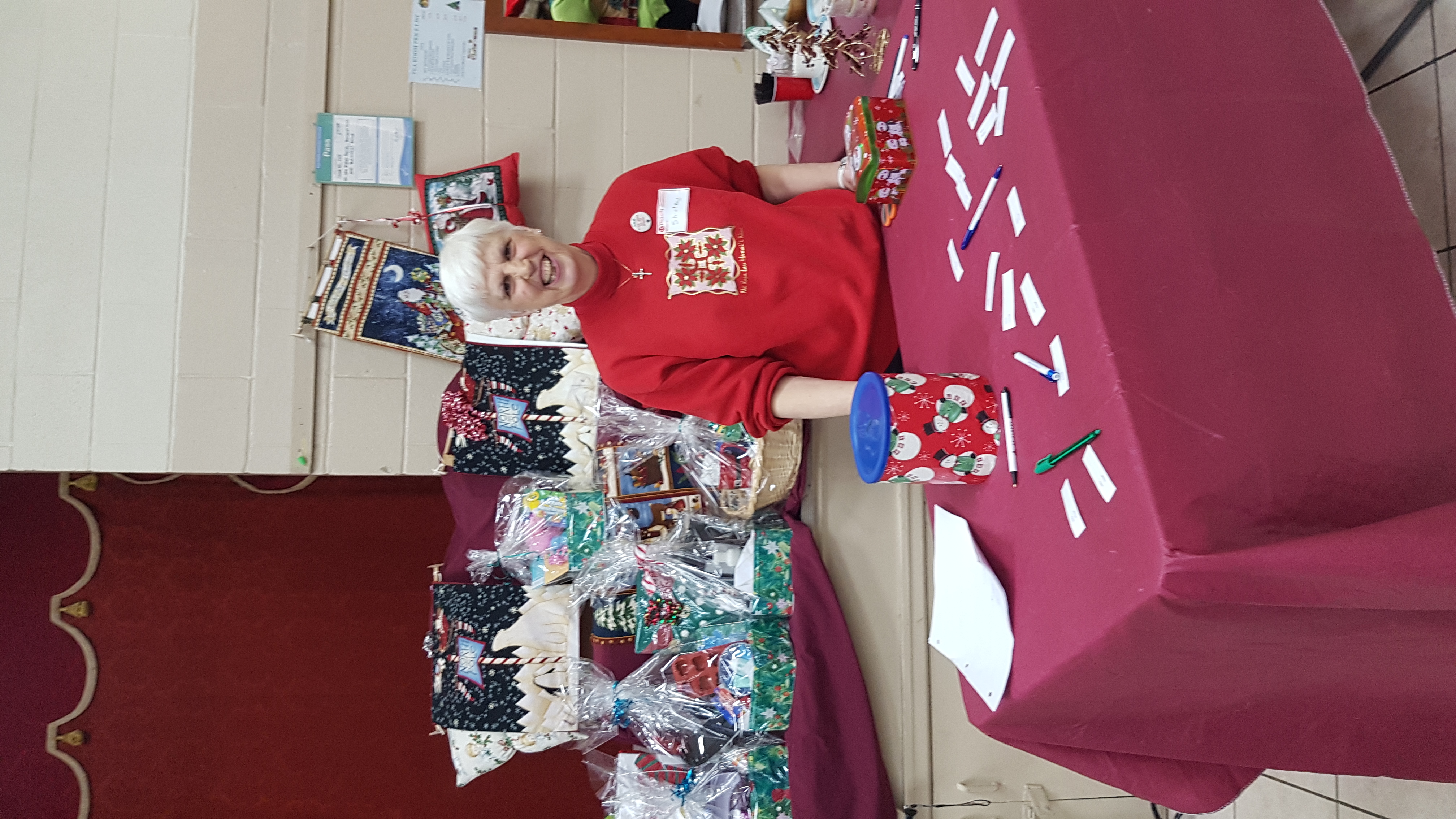 picture of Shirley selling raffle tickets for baskets
