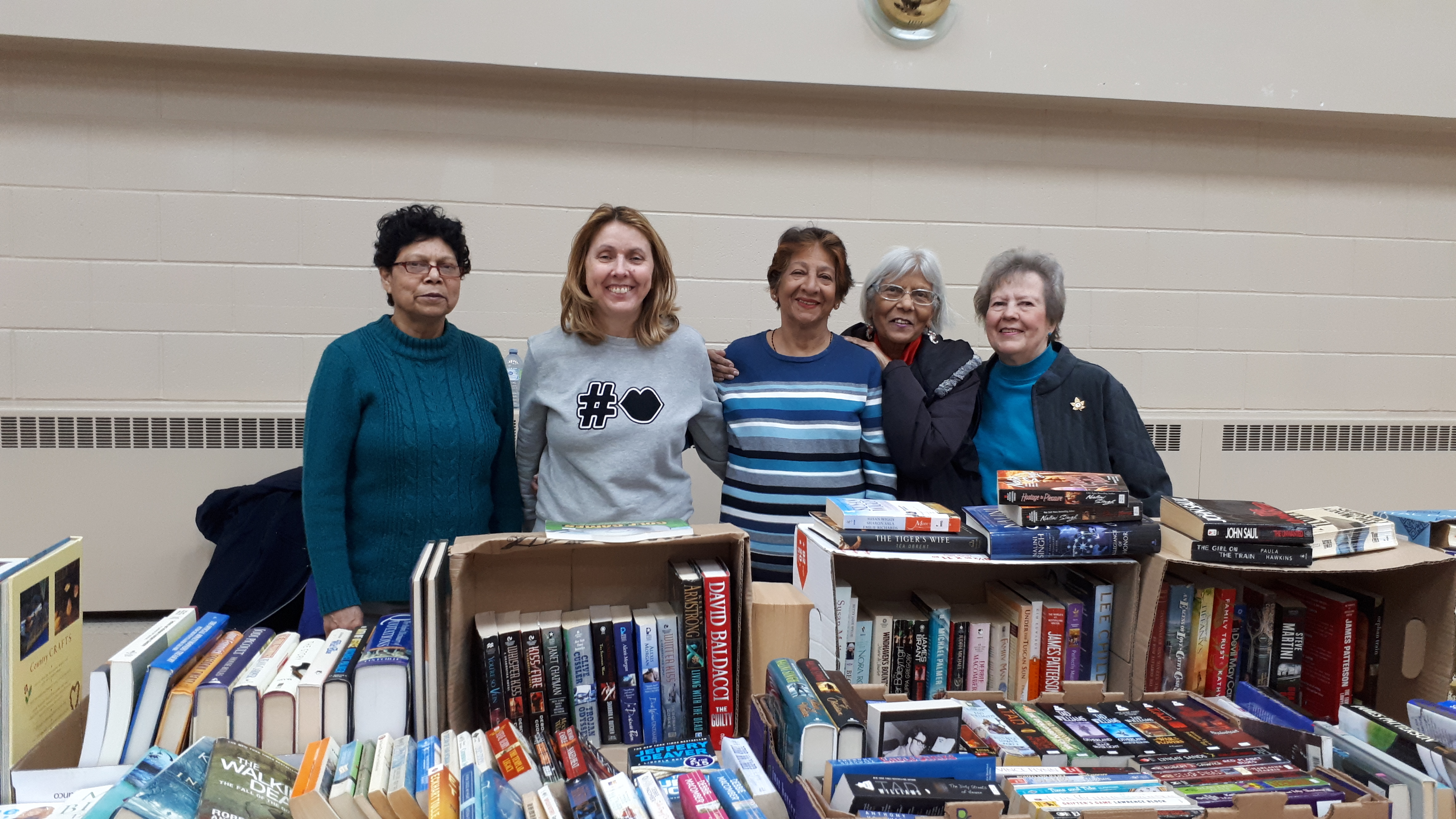 CWL members helping at the book table