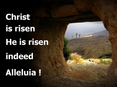 Words Christ is risen He is risen indeed. image of looking out from an empty tomb to the Calvary Hill and 3 crosses