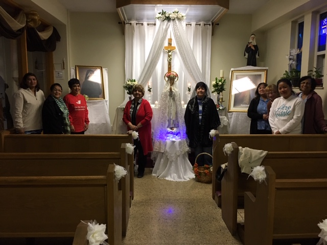 picture of the members of the Rosary Group standing at the front of the Chapel