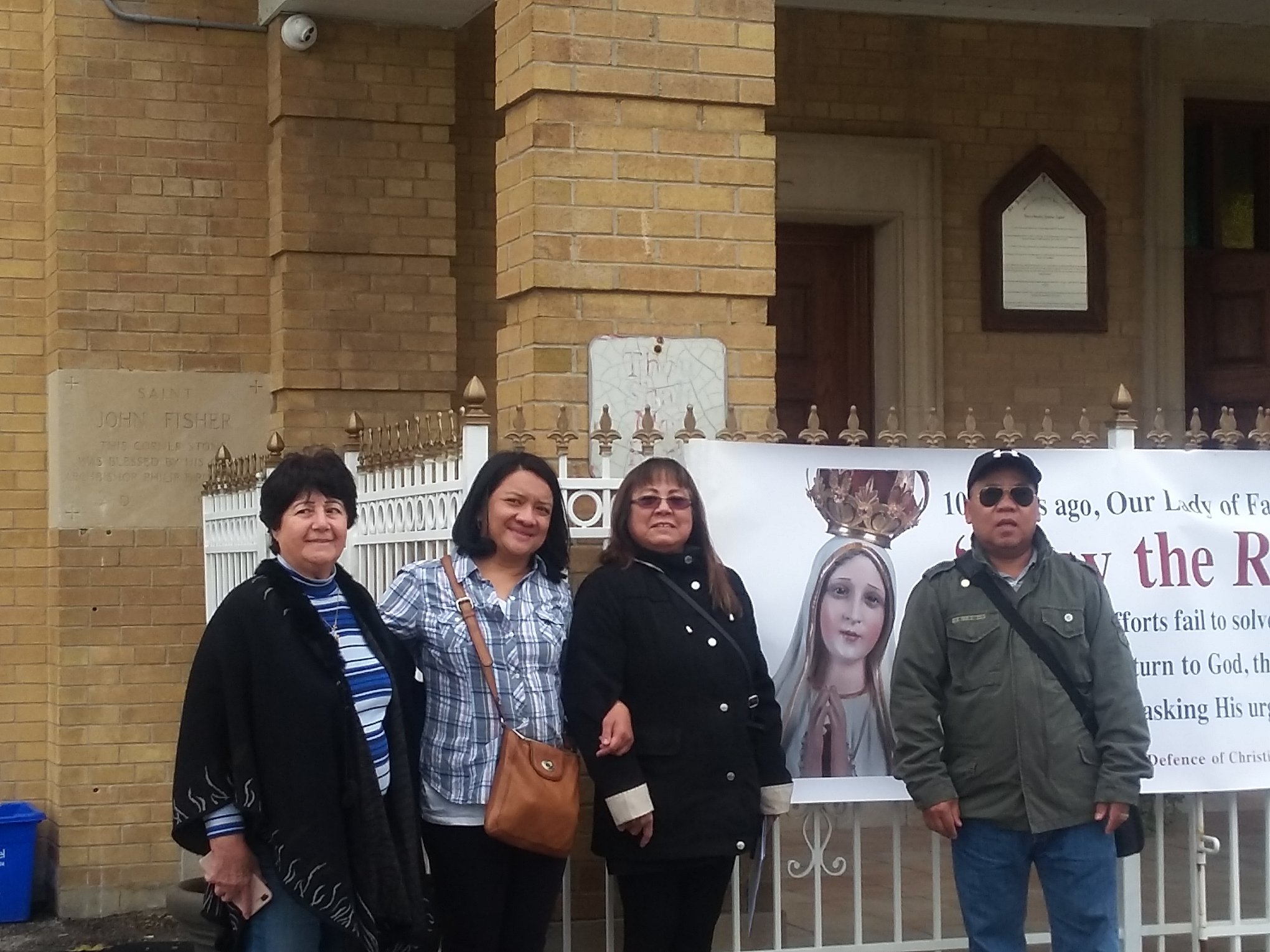 Helen, Alice, Lorraine and man in front of church