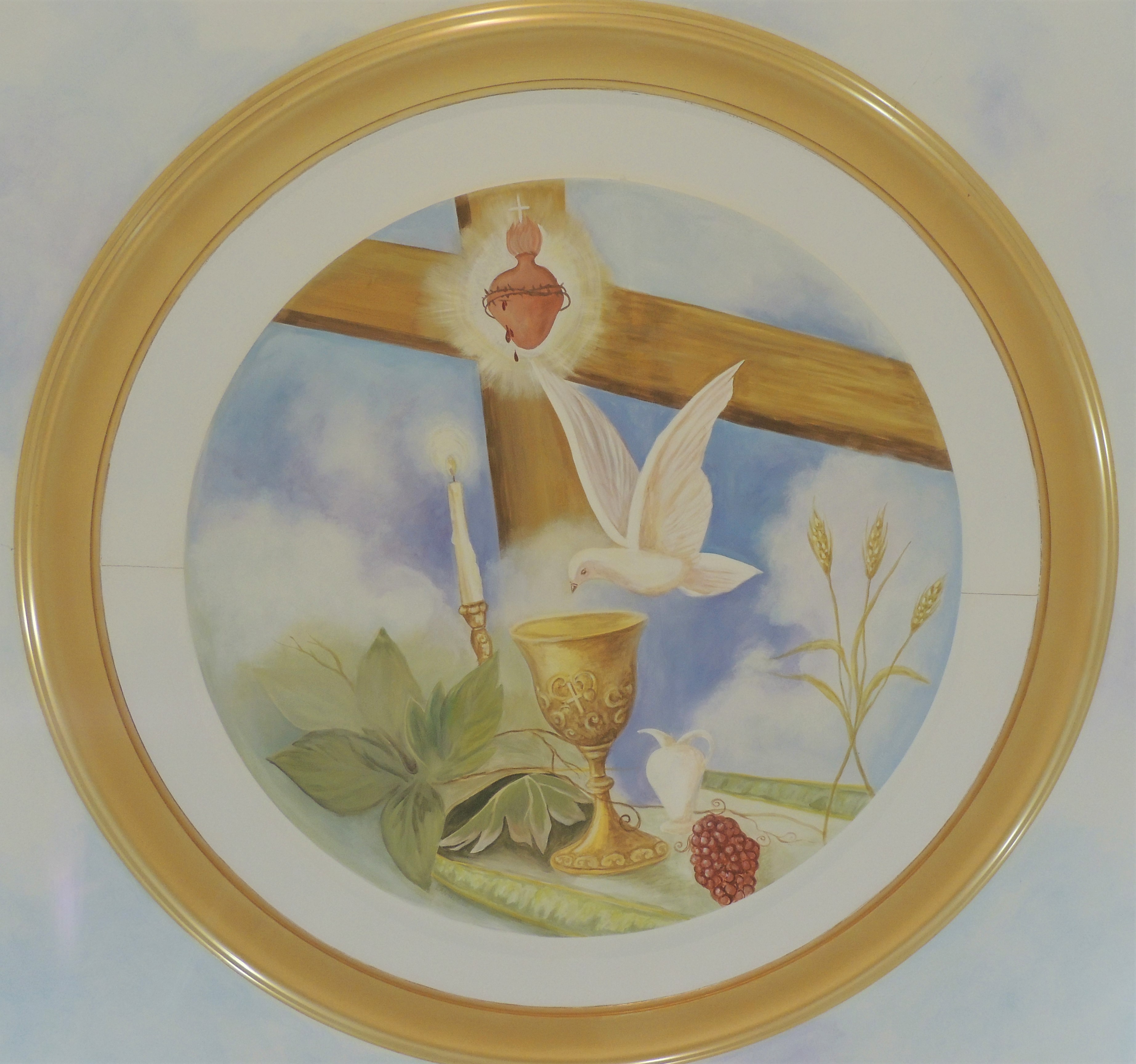 Mural above altar: sacred heart, dove, cross, chalice, jug, wheat, grapes, candle, vine